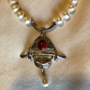 Freshwater pearl necklace with sterling silver and red jasper attached enhancer.